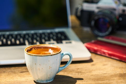 digital nomad working on a laptop in a café