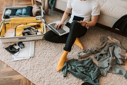 A traveler investing from a laptop