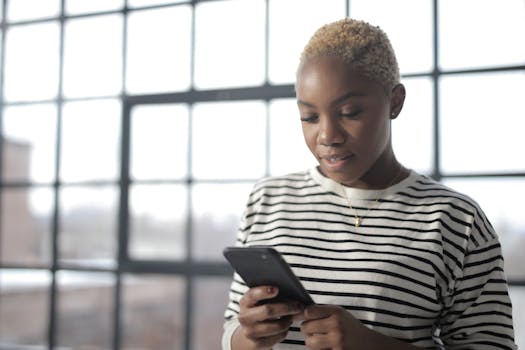 person checking cryptocurrency prices on a smartphone