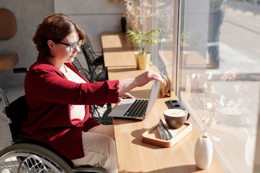 digital nomad working on a laptop in a café