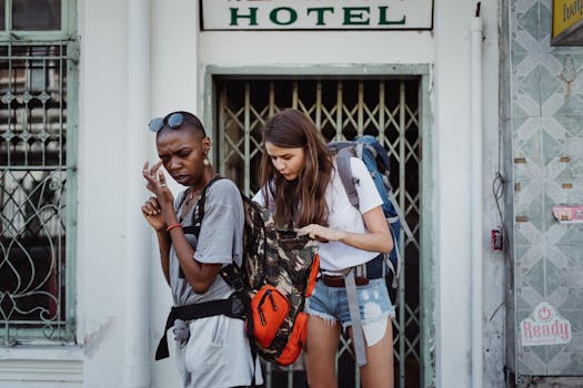 A traveler checking multiple currencies in a city