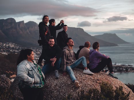 A happy digital nomad enjoying a sunset while traveling