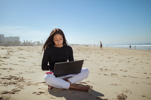 digital nomad working on the beach