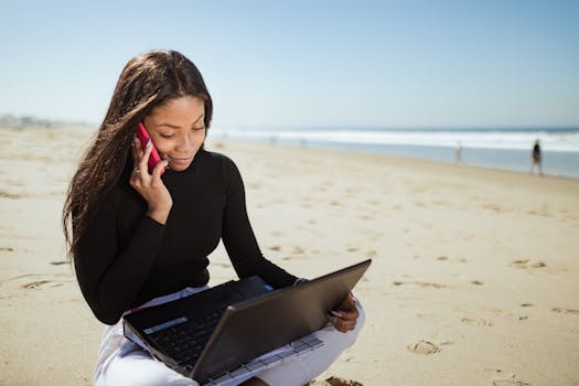 digital nomad working by the beach