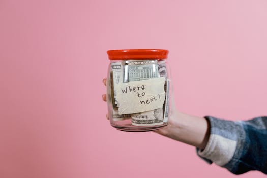 savings jar with travel labels