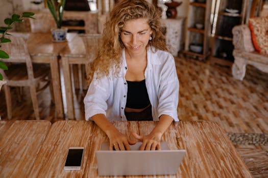 a digital nomad working on a laptop in a café