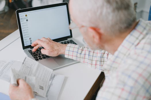 A person checking their finances on a laptop