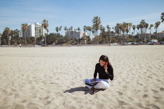 digital nomad working from a beach