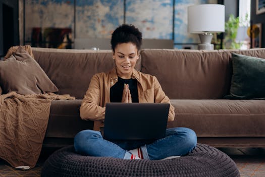 person using a laptop for budgeting